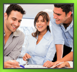 Office workers sitting together, collaborating in a modern office environment.