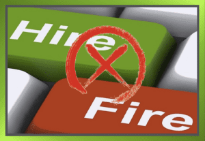 Computer keyboard with green 'Hire' button, red 'Fire' button, and a big red cross over the image