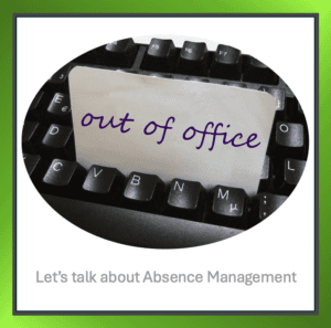 A computer keyboard with a card saying 'Out of Office', symbolising employee absence.