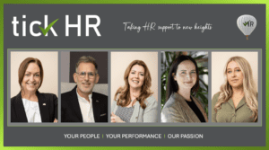 Five members of the Tick HR Solutions team discussing the crucial role of HR in supporting businesses and employees.