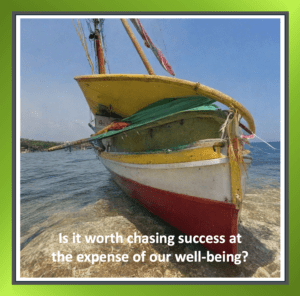 Silhouette of a fishing boat on a beach at sunset, paired with a reflective story about balancing success and well-being.