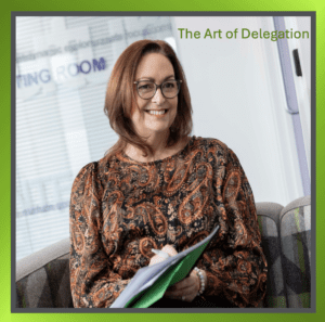A person standing in a professional setting, symbolising leadership and delegation.