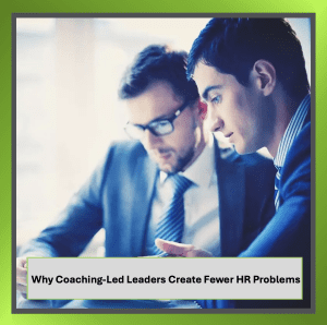 Two colleagues working together in an office to reflect coaching-led leadership and collaboration