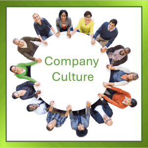 Group of people holding hands around a table, symbolising teamwork and company culture.