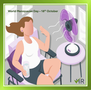 office scene of a woman experiencing a hot flush and cooling down in front of a desk fan-world menopause day
