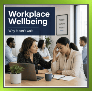 Manager supporting an employee in a UK office about workplace wellbeing